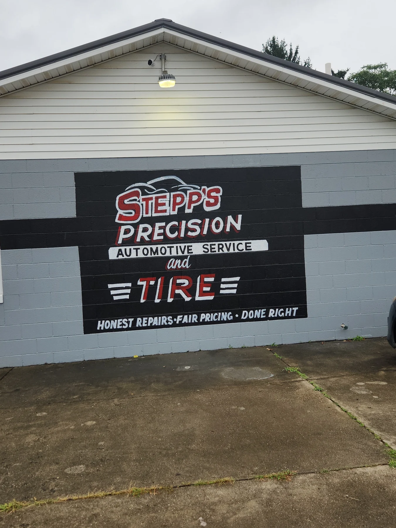 The painted Stepp's Precision Automotive Service and Tire mural at 2031 Poplar Street in Kenova