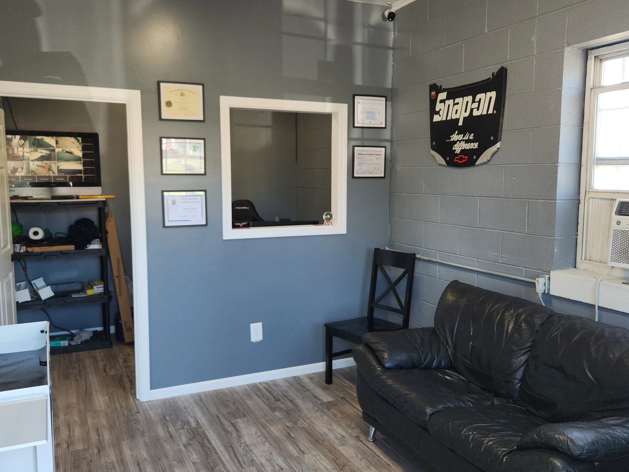 The clean gray and black customer waiting room at Stepp's